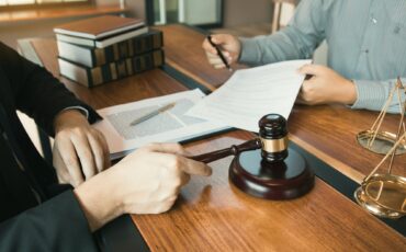 Client is bringing the documents to clarify the law to the lawyer at the prosecutor office.