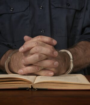 Criminal reads a law book